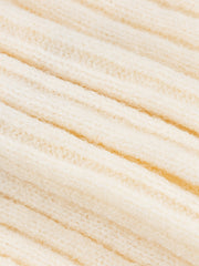 A close-up view of a cream-colored, ribbed knit fabric with a soft, textured finish.