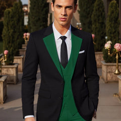 A man wears a black suit jacket with green lapels, a green vest, and a white dress shirt.