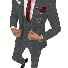 A man wears a slim-fit grey plaid three-piece suit with a red patterned tie and pocket square.