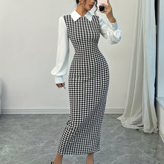 A woman wears a black and white houndstooth bodycon dress with a white collar and puffed sleeves.