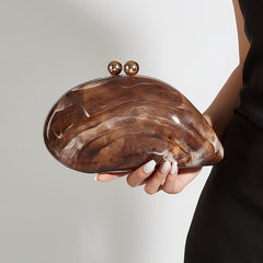 A coffee-colored marbled acrylic clutch with a smooth, rounded shape and two gold bead clasps.
