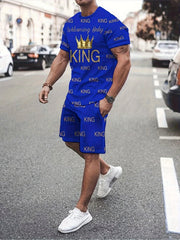 A man wears a blue short-sleeve t-shirt and shorts set featuring a repeating King print.