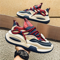 A pair of chunky, multi-colored men's sneakers with red laces and a thick, shock-absorbing sole.