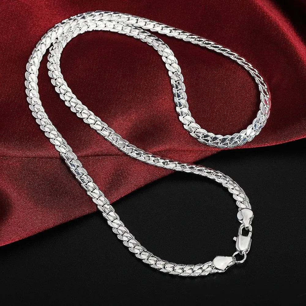 The 925 sterling silver 18K gold 6MM chain bracelet necklace for women and men features a geometric textured pattern and secure lobster clasp, displayed on red satin and a black surface—perfect for parties, weddings, or as gift jewelry sets.