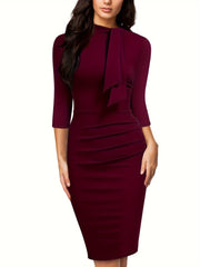 A burgundy knee-length sheath dress with three-quarter sleeves and a tie-neck detail.