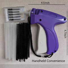 A purple handheld clothing tagging gun with replacement needles and black and white fasteners.
