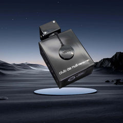 A black rectangular bottle of Armaf Club de Nuit Intense Man perfume floats above a dark landscape.