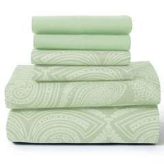 A stack of light green microfiber sheets featuring a white paisley pattern.