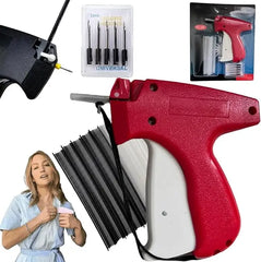 A red and white clothing tagging gun with replacement needles and a pack of fasteners.