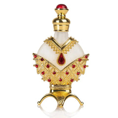 The Arabian rich Middle Eastern style essential oil perfume "reverses Paris, true blue" features a round white bottle with ornate gold and red jeweled details, a gold neck, and pointed red-topped cap on a gold base with curved legs.