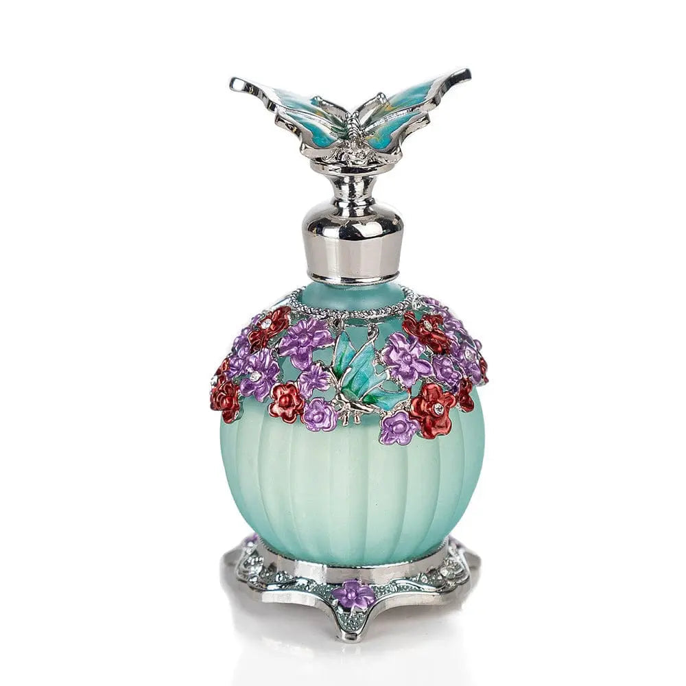 The Arabian Rich Middle Eastern style essential oil perfume, "Reverses Paris True Blue," features a decorative light blue bottle with a silver butterfly-shaped cap and intricate floral detailing, expertly crafted by cosmetics R&D professionals.