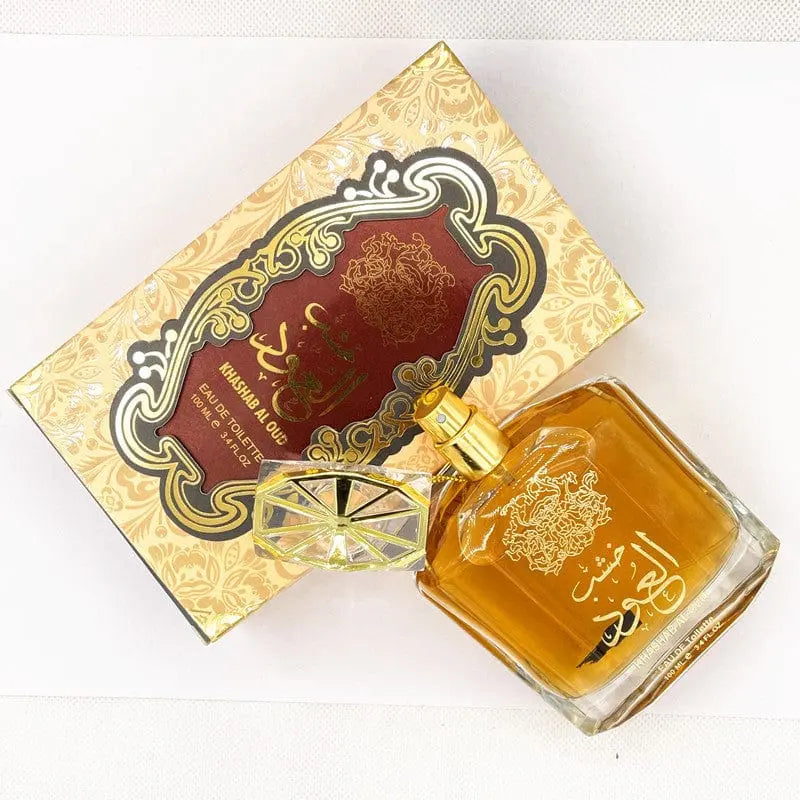 The Arabian sandalwood atmospheric perfume for Middle East trade features a rectangular bottle with golden Arabic script and faceted cap beside its ornate gold-maroon box. Amber liquid inside reflects certified cosmetics standards and quality control.
