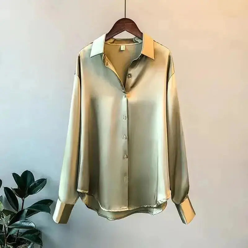 A long-sleeved, loose-fit silk-look blouse in a solid olive green with a turn-down collar.