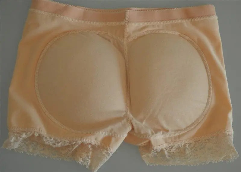 The Body Shapers Butt Lifter Faja are beige, plus size slimming padded panties with lace trim, designed to enhance the hips and buttocks while providing tummy control for women.