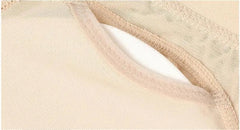 Close-up of beige mesh fabric with stitched seam and opening, revealing a white inner layer from Body Shapers Butt Lifter Faja Plus Size Slimming Tummy Control Lace Decorated Padded Panties for Women.