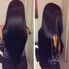A woman with long, straight, shiny black hair—styled with Bone Straight Human Hair Bundles 30-Inch Brazilian Remy Extensions for Black Women—is shown from the back and side indoors with a door and chair in view.