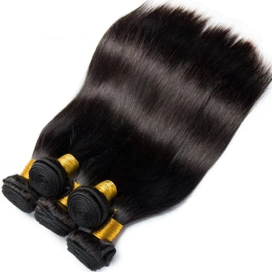 Four bundles of Bone Straight Human Hair Bundles, 30-inch Brazilian Remy Extensions in natural color, are neatly stacked and secured with gold bands. These silky bundles offer a sleek look, ideal for Black women.
