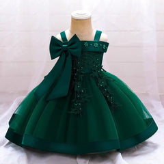 The Bow Summer Dresses Infant Baby Girl Birthday Party Dress showcases a sleeveless dark green gown with a tulle skirt, floral lace appliqué, bead accents, and a large bow on the left strap, displayed on a mannequin against a light background.