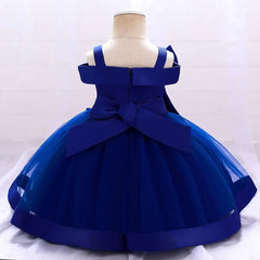 A child-sized mannequin displays the Bow Summer Dresses Infant Baby Girl Birthday Party Dress—a sleeveless deep blue gown with a full tulle skirt and large back bow—against a light, neutral background.