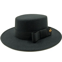 A black flat-top fedora hat with a matching ribbon bow and a small gold bee emblem.