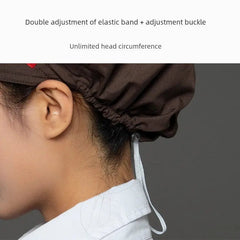 A close-up view of a brown chef cap featuring an adjustable elastic band and buckle at the back.