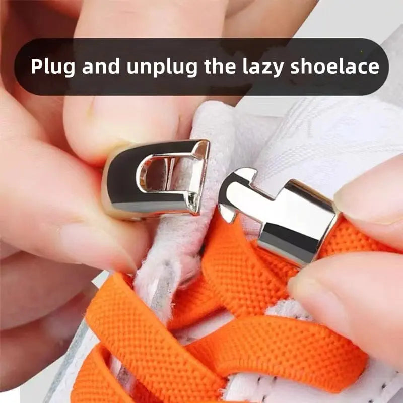 Close-up of hands fastening the metal clasp on bright orange Cross buckle Elastic No Tie Shoelaces for Sneakers, attached to a white sneaker, with “Plug and unplug the lazy shoelace” displayed above.