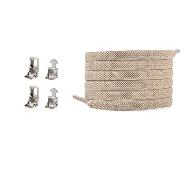 Cross buckle Elastic No Tie Shoelaces for Sneakers in beige are coiled on the right, with four silver metal clips arranged in two vertical pairs on the left, all displayed against a white background.