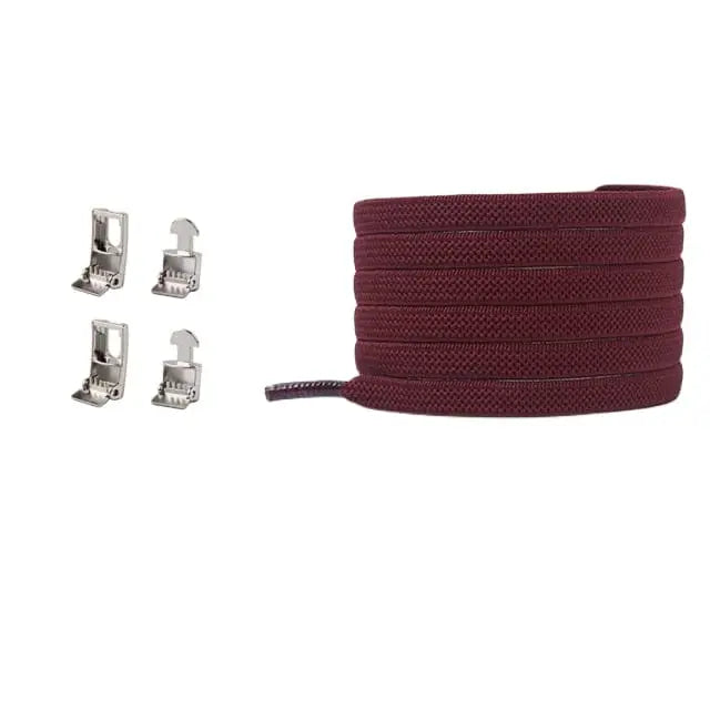 A Cross buckle No Tie Elastic Shoelace in burgundy is coiled next to four small silver aglets, displayed on a white background.