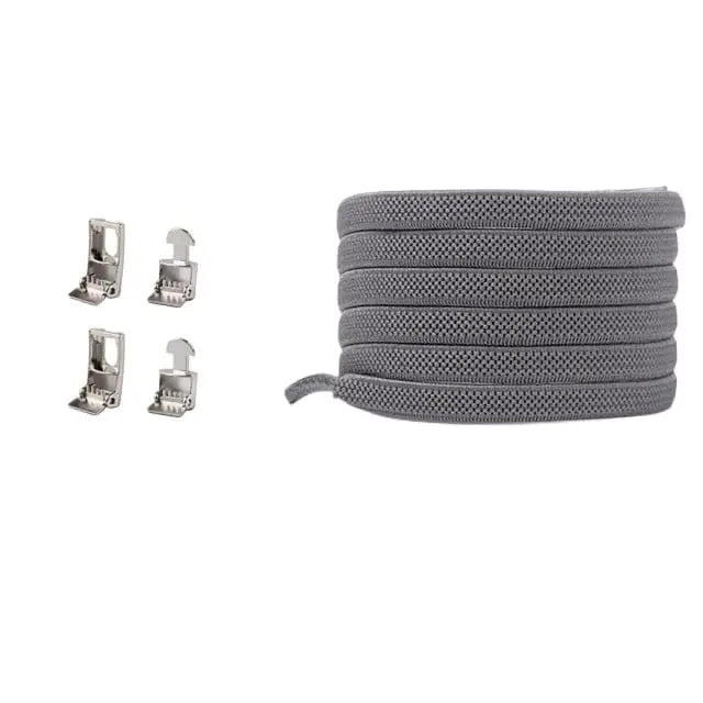A grey Cross buckle Elastic Shoelace (No Tie) is coiled on the right, with four small silver clips on the left, shown against a white background. Fits both kids and adult sneakers; one size fits all.