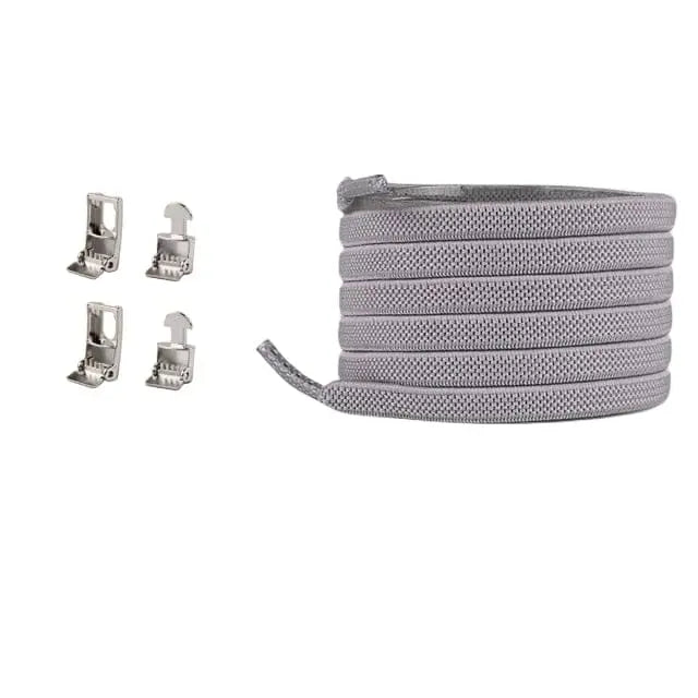 A coiled grey Cross buckle Elastic Shoelace No Tie for Sneakers is shown on the right, with four different metal aglets displayed separately on the left, all set against a white background.