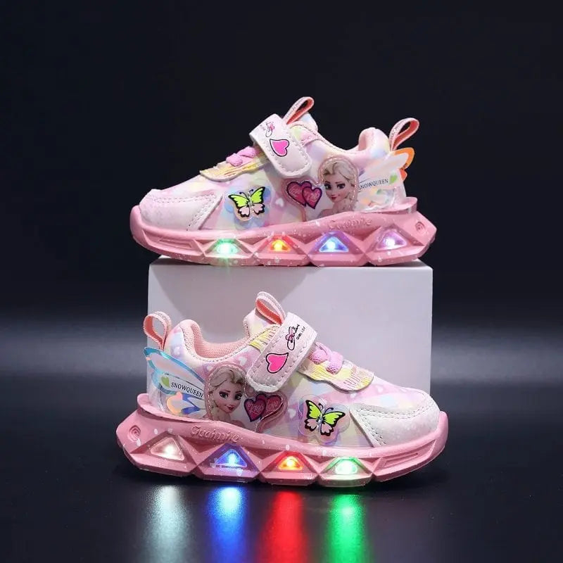 Disney LED Casual Sneakers for girls in pink feature a Frozen Elsa princess print, PU leather material, non-slip soles, and multicolored lights, shown against a black background.