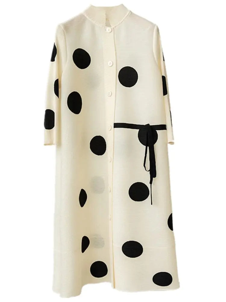 The Elegant Stand Collar Pleated Dress features a cream dot print with black polka dots, 3/4 sleeves, pleated details, and a black waist tie belt—ideal as a festival dress or for any special occasion.