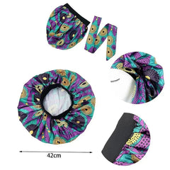 An extra large satin sleep bonnet featuring a colorful African print and an adjustable wide band.
