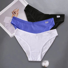 A set of three solid-colored, ribbed cotton low-rise briefs in black, blue, and white.