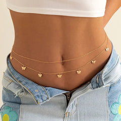 A person wears light blue jeans and a white crop top, styled with the Fashion Classic Cute Butterfly Waist Chain—a thin, sexy body chain adorned with butterfly charms, perfect as summer vacation jewelry.