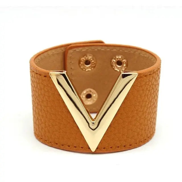 The Fashion Leopard Leather Bracelet for women features a wide, textured brown cuff with a bold gold V accent and snap closures—a stylish, statement wristband perfect for adding flair to any outfit.