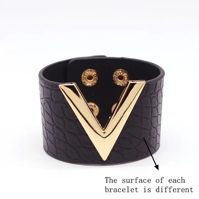The Fashion Leopard Leather Bracelet for women features a wide cuff design with a gold V detail, unique textured surface, and snap button closure—perfect as an all-match charm wrap wristband.