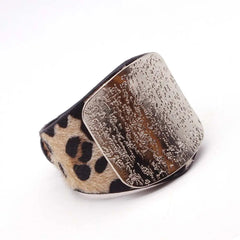 The Fashion Leopard Leather Bracelet for Women features a wide band with leopard print fur and a large textured metallic plate. This simple, all-match cuff wrap charm wristband is perfect for stylish women’s jewelry collections.