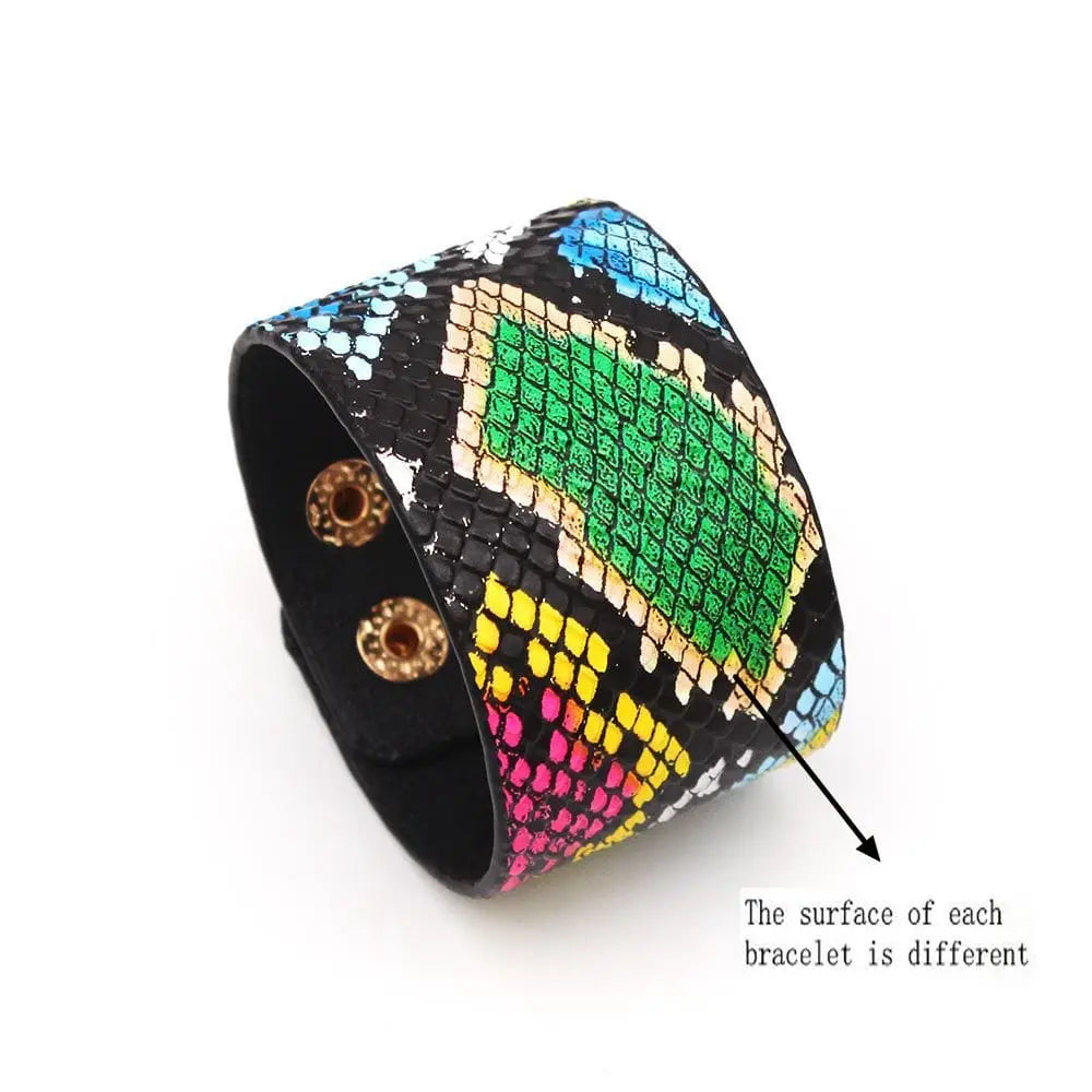 The Fashion Leopard Leather Bracelet for women is a wide, multicolored faux leather cuff with a unique textured pattern in green, blue, pink, yellow, and black. Each bracelet features a snap closure and an all-match V word charm design.