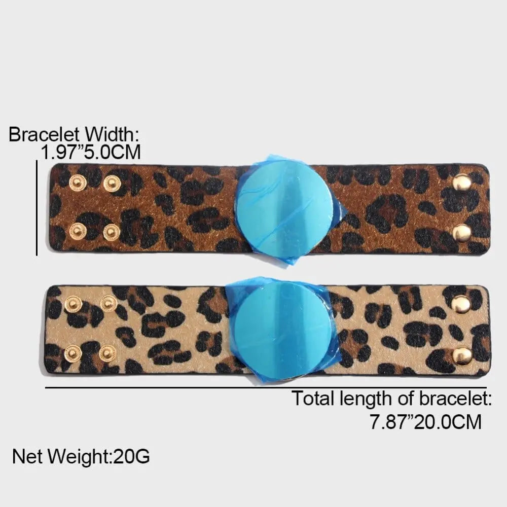 Two Fashion Leopard Leather Bracelets for women are shown horizontally, each with a blue circular centerpiece and gold snap buttons. Each cuff is 1.97 inches (5 cm) wide and 7.87 inches (20 cm) long.