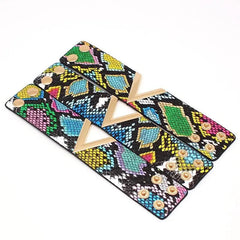 Three colorful Fashion Leopard Leather Bracelets for women, featuring gold V-shaped accents and snap closures. The wide cuff wrap design showcases a vibrant pattern with blue, green, yellow, pink, and black scales.