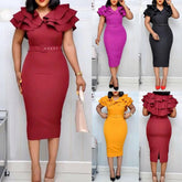A woman models a solid color midi dress with a V-neck, ruffled sleeves, and a matching belt.