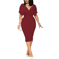 A woman wears a burgundy midi bodycon dress with a V-neck and pearl-embellished short sleeves.