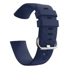 A navy blue silicone replacement band for a Fitbit Charge 3 with a silver buckle.