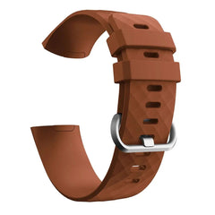 A brown silicone replacement watch band for a Fitbit Charge 3 with a silver buckle.