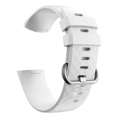 A white silicone replacement band for a Fitbit Charge 3 with a silver buckle.