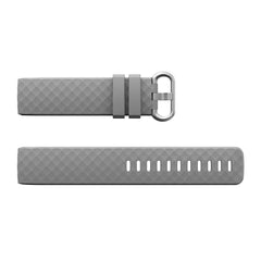 A grey silicone replacement wristband for a Fitbit Charge 3 with a silver buckle.