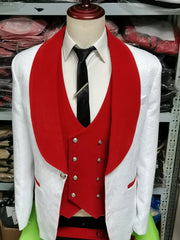 A mannequin showcases the Floral Jacket Men Suit Slim Fit—a navy blue velvet blazer with floral patterns and lapel, white shirt, red waistcoat, black tie with clip, and silver buttons—ideal inspiration for men's business suits. Clothing shelves are in the background.