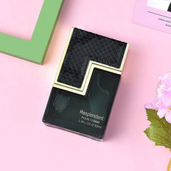 A rectangular bottle of Resplendent Pour Femme perfume with a black snakeskin-textured top.