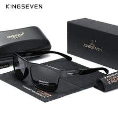 A pair of black polarized sunglasses with a matching case, cleaning cloth, and gift box.